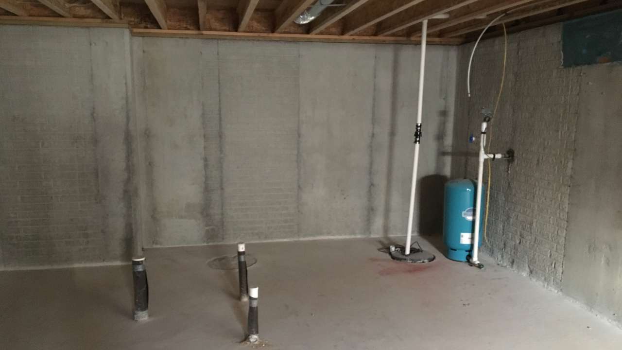 Initial basement inspection identifying structural and layout considerations before finishing