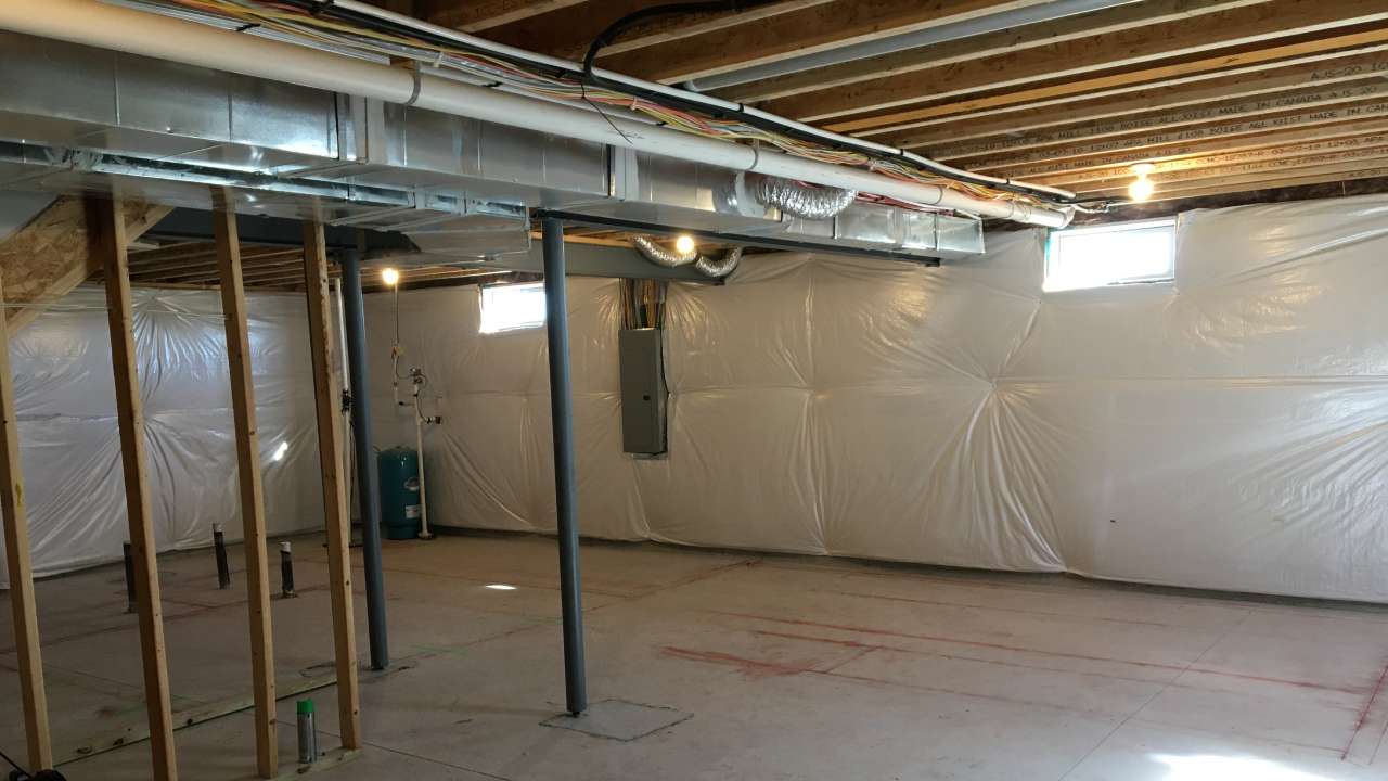 Rigid foam insulation installed on basement foundation wall for moisture control