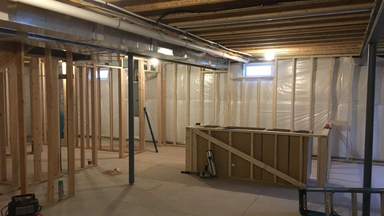 Basement framing and thermal insulation system before drywall installation